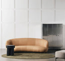 Curved brown leather sofa