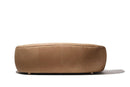 Curved brown leather sofa