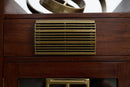 Close-up of a dark reddish-brown converted Art Deco speaker cabinet  featuring a rectangular brass ventilation grille on the drawer front.