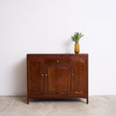 Vintage Art Deco Teak Sideboard with a small plant on a white background