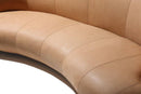 Curved brown leather sofa