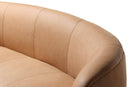 Curved brown leather sofa