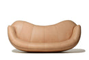Curved brown leather sofa